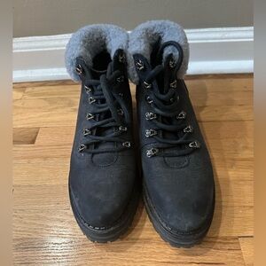 MGemi black, alpine buckskin leather boot. Lace up-front, shearling at ankle.